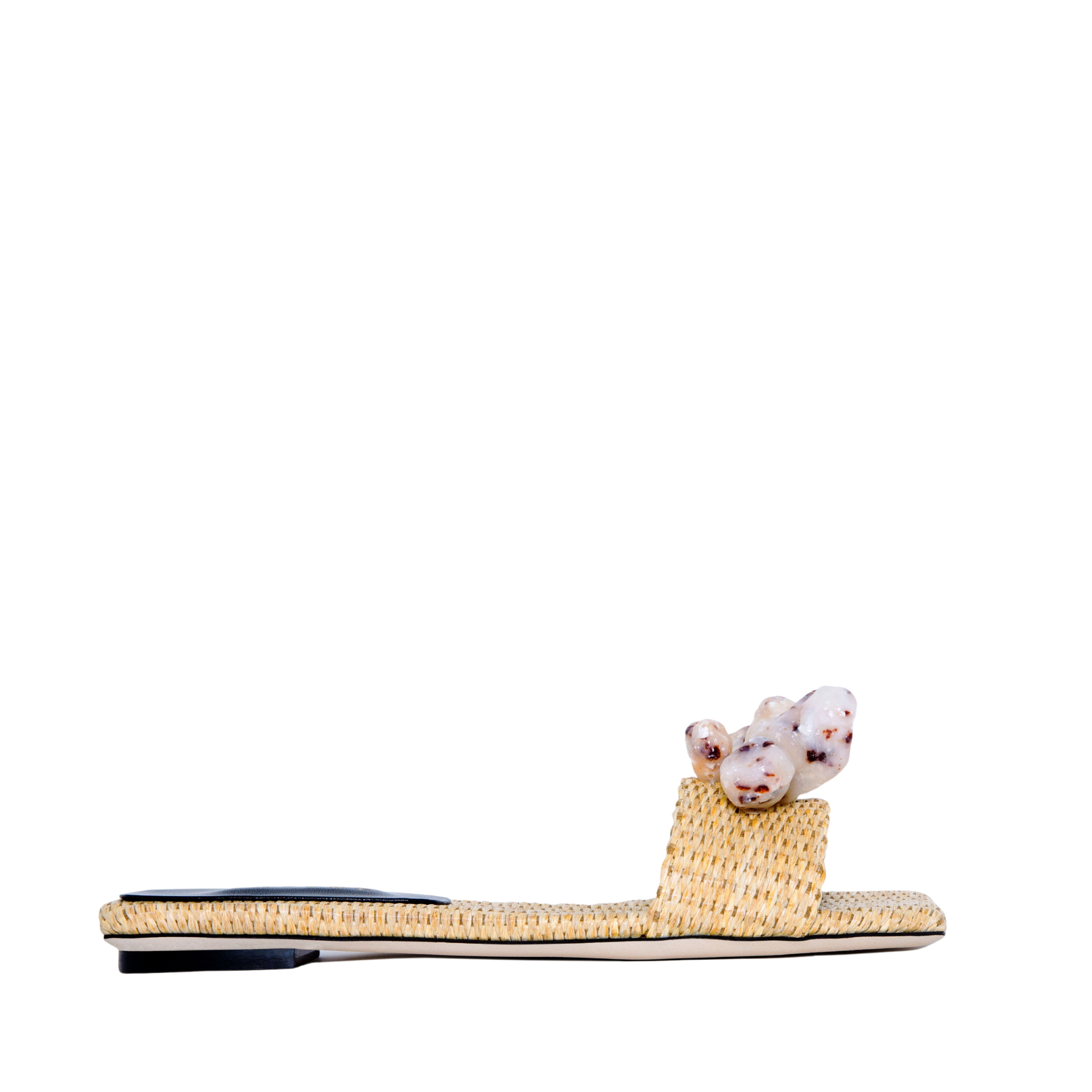 Taurea Natural Flat Sandal in sand raffia with stone embellishments, low heel, and square toe design.